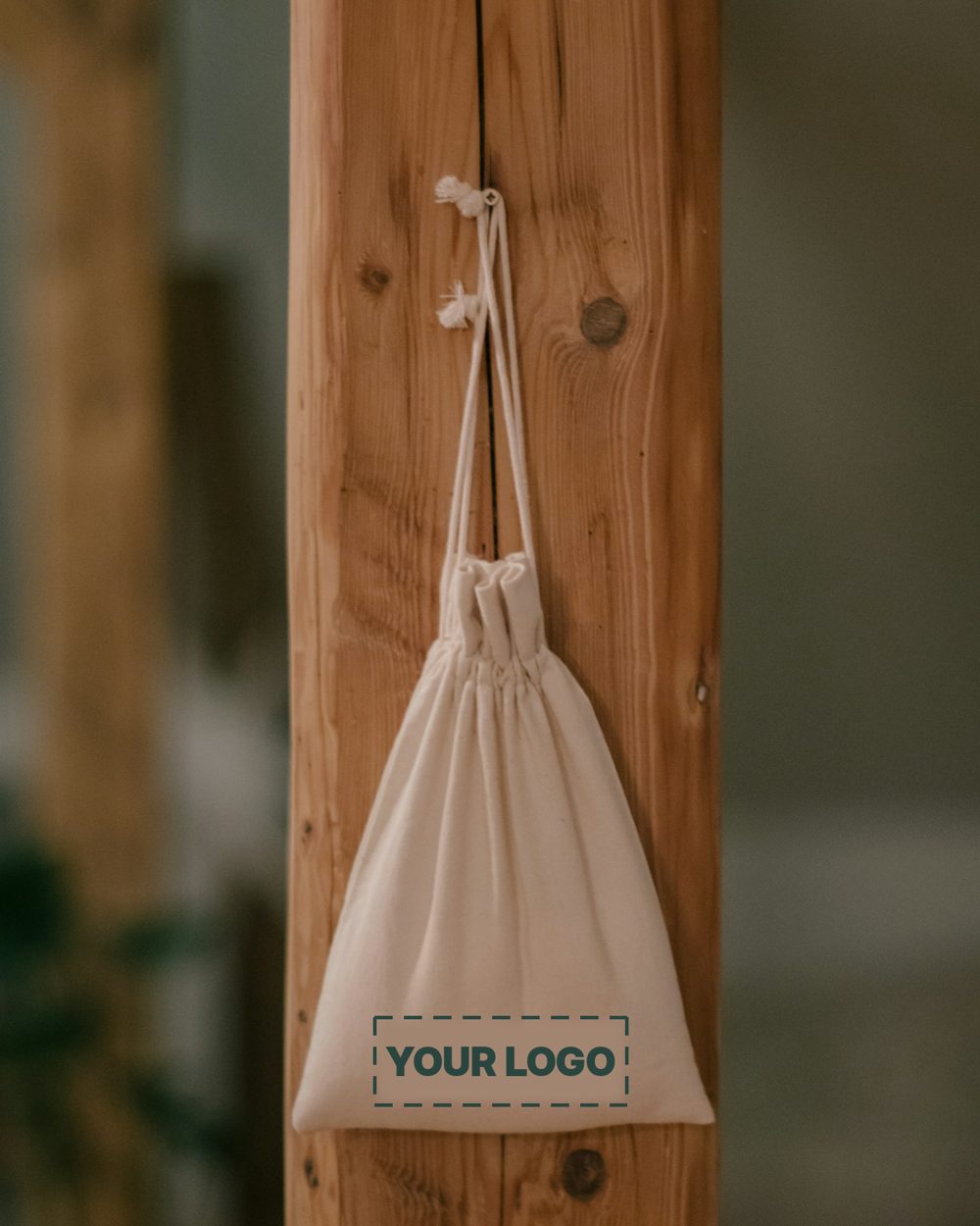 Cotton drawstring bag with a sample logo printed on the front